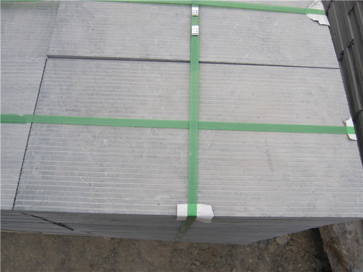 青石板荔枝面斜紋面路沿石在傳統(tǒng)建筑環(huán)境中的材質統(tǒng)一性體現(xiàn)